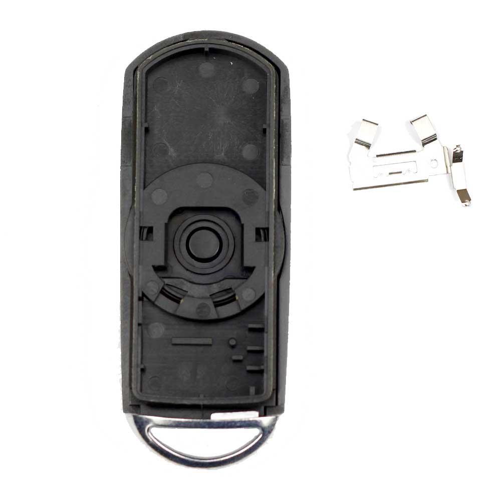 Fekete színű, 2 gombos Mazda kulcsház, kulcs belseje.